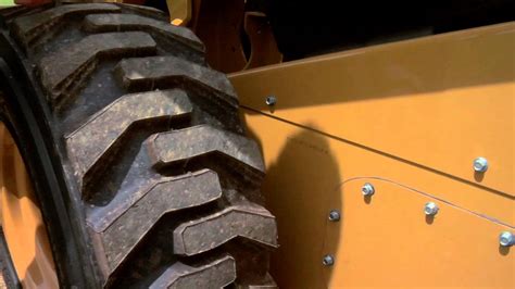 how to adjust drive chain in nweholland skid steer|new holland ls170 chain adjustment.